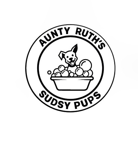 Logo of Aunty Ruth's Sudsy Pups featuring a playful dog in a bubble bath